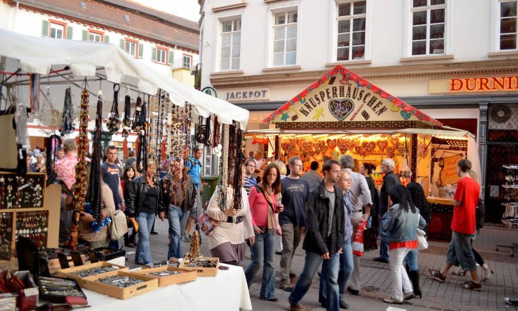 People walk the Hauptstrasse, Heidelberg's pedestrianized street, at the annual Herbstfest (Autumn Fest).