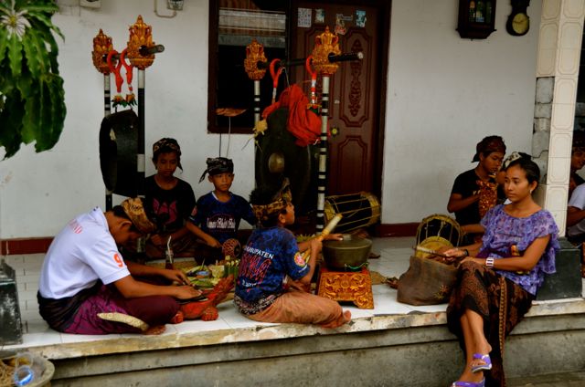 Boys in Jinbaran playing Balinese instruments at purification ritual