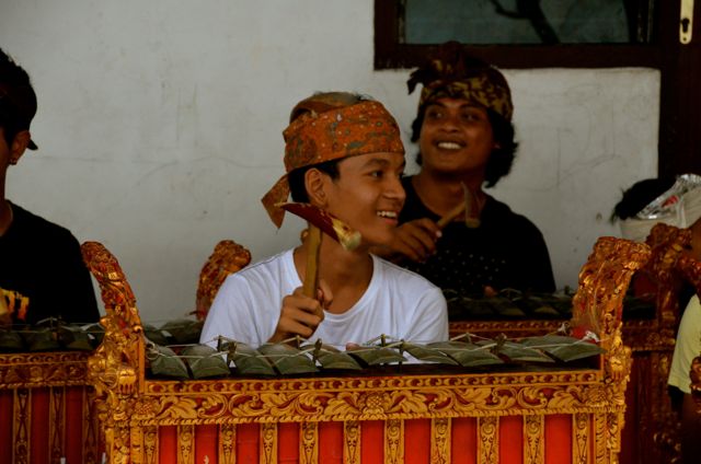 Young man playing Balinese instrument