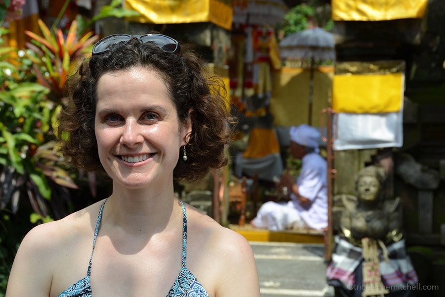 Tricia and Ketut Liyer A woman stands in front of the Ketut Liyer home in Ubud, Bali.