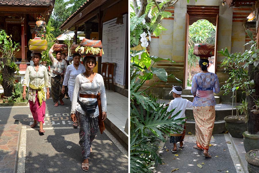Locals visit Ketut Liyer home Women balance baskets containing spiritual offerings on top of their heads as they make their way into the inner courtyard of the Ketut Liyer home.