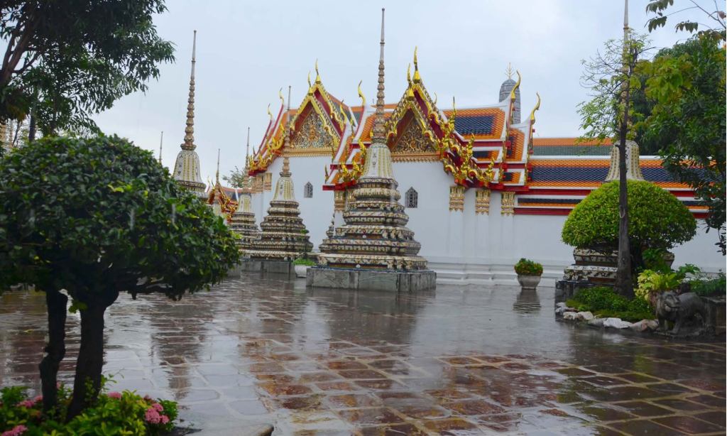 Puddles of rain collect in the courtyard of Bangkok's Wat Pho temple.