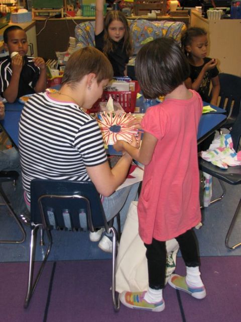 Child presents homemade flower