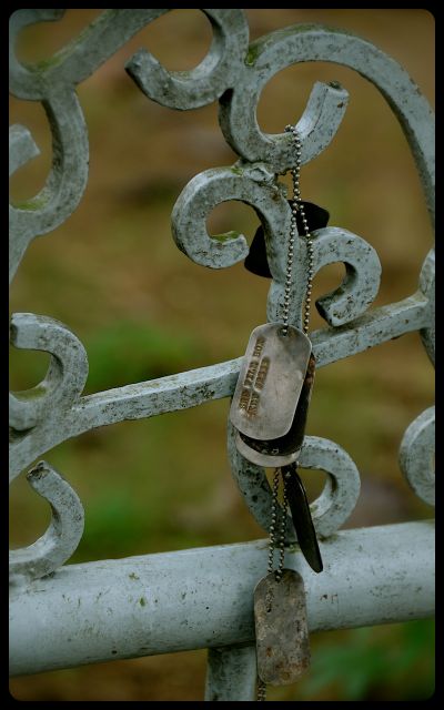 Dog Tags for Sale in Hue, Vietnam dog tags for sale, hanging on railing