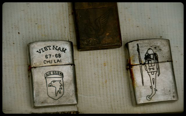 Vietnam War Items For Sale in Hue, Vietnam cigarette lighters for sale on Vietnamese sidewalk