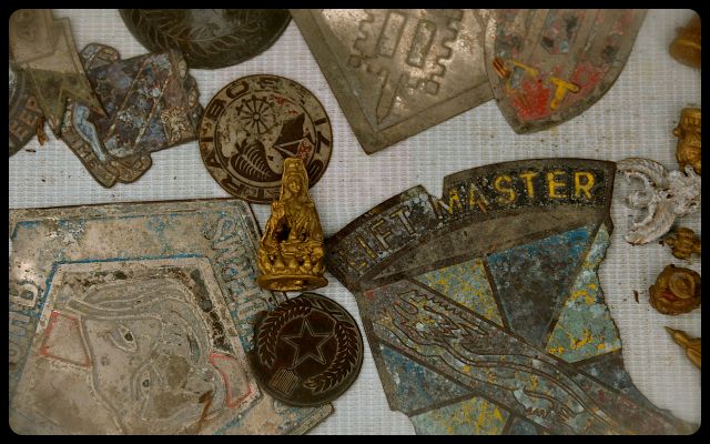 War Items for Sale in Hue, Vietnam war medals for sale on Vietnamese sidewalk in Hue