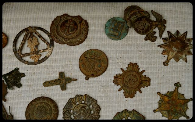 War Items for Sale in Vietnam war medals for sale, laying on blanket in Vietnam