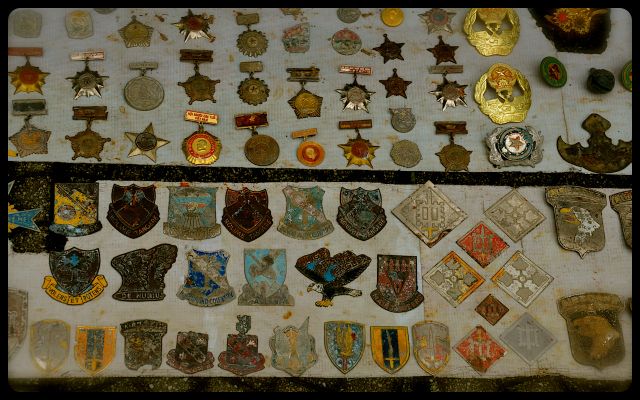 War Items For Sale in Vietnam canteens, war medals and dog tags for sale on Vietnamese sidewalk