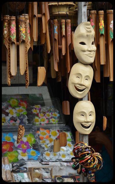 Masks and wind chimes for sale in Bali Masks and wind chimes for sale in an Ubud, Bali market.