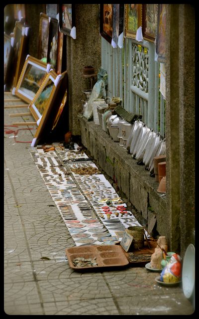 Dog Tags and Antique Items for Sale in Hue, Vietnam canteens, war medals and dog tags for sale on Vietnamese sidewalk