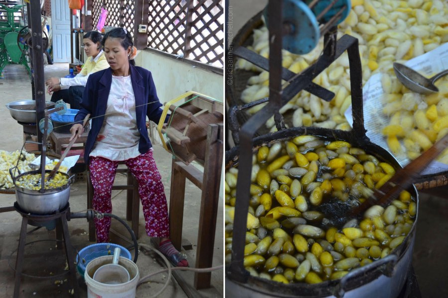An employee stirs a pot of boiling water containing silkworm cocoons.