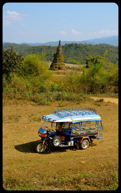 Tuktuk in Laos by Grassy Stupa