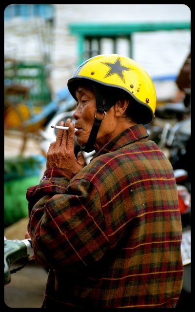 Man smoking in Hoi An Vietnam Man smoking in Hoi An Vietnam