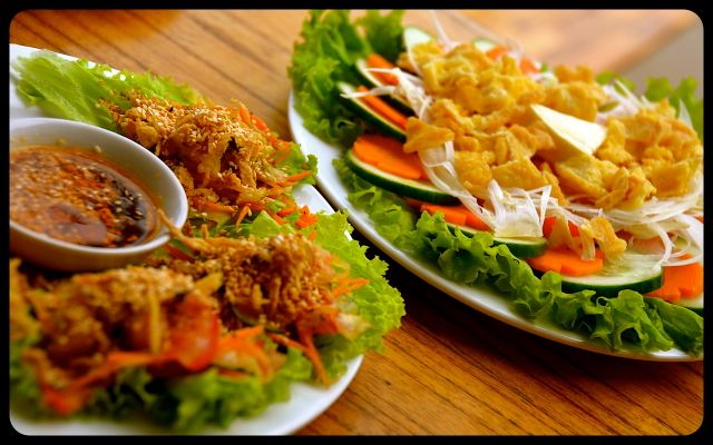 Plates of Vietnamese food in Hoi An Plates of Vietnamese food in Hoi An