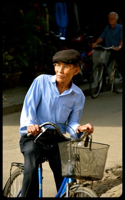 Man on bike in Hoi An Vietnam Man on bike in Hoi An Vietnam