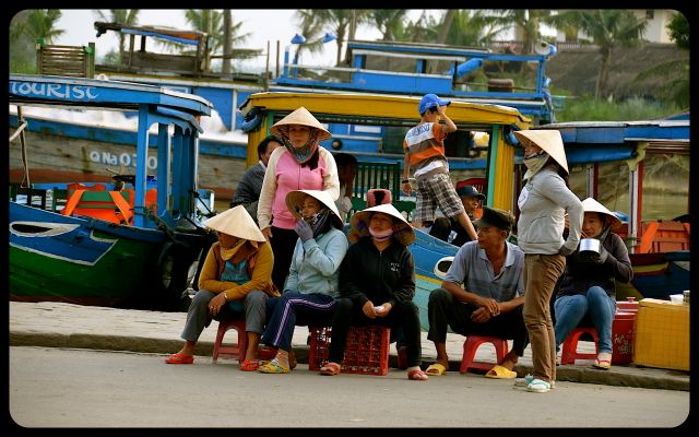 Locals in Hoi An Vietnam Locals in Hoi An Vietnam