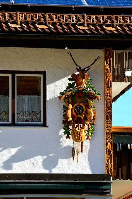 A cuckoo clock hangs outside of a shop in Oberammergau, Germany.