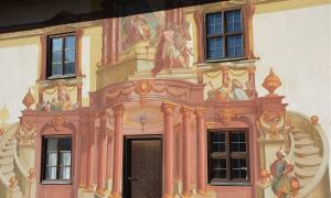 The colorful, fresco-painted facade of the Pilatushaus