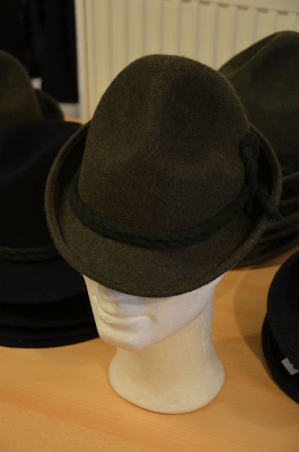 A traditional Bavarian woolen hat sits atop a mannequin head.