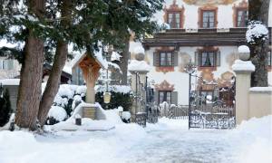 The village of Oberammergau's St. Peter and Paul Cemetery Germany, covered in snow