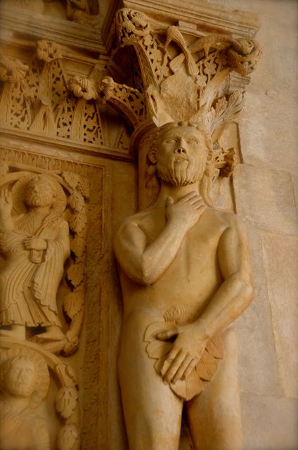 Adam statue inside the portal of the St. Lawrence Cathedral in Trogir, Croatia