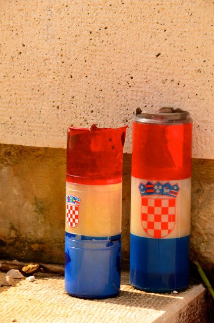 Candles sit by a memorial atop Mount srdj, in Dubrovnik.