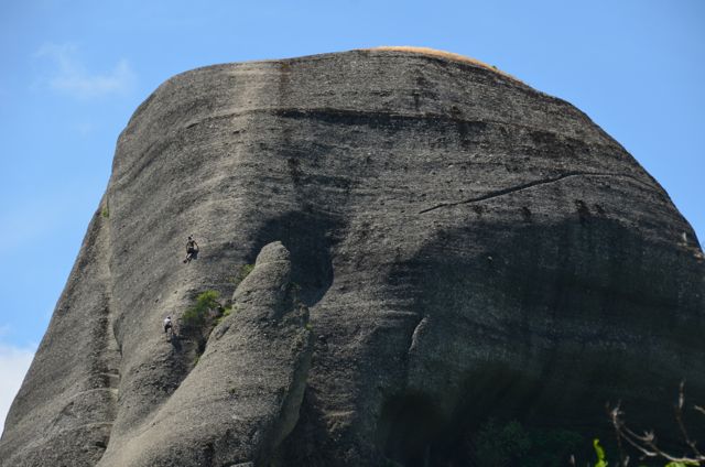 rock climbers scale formation in meteora greece