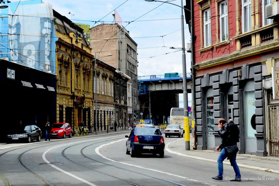 A man crosses the road in Belgrade's Savamala neighborhood
