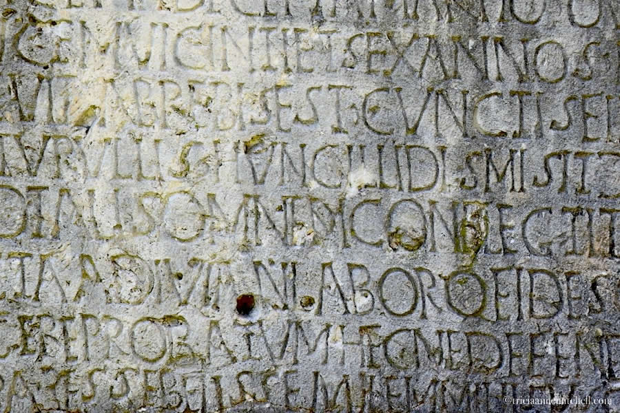 A weathered inscription, among the historic ruins of Salona, near present-day Solin, Croatia.