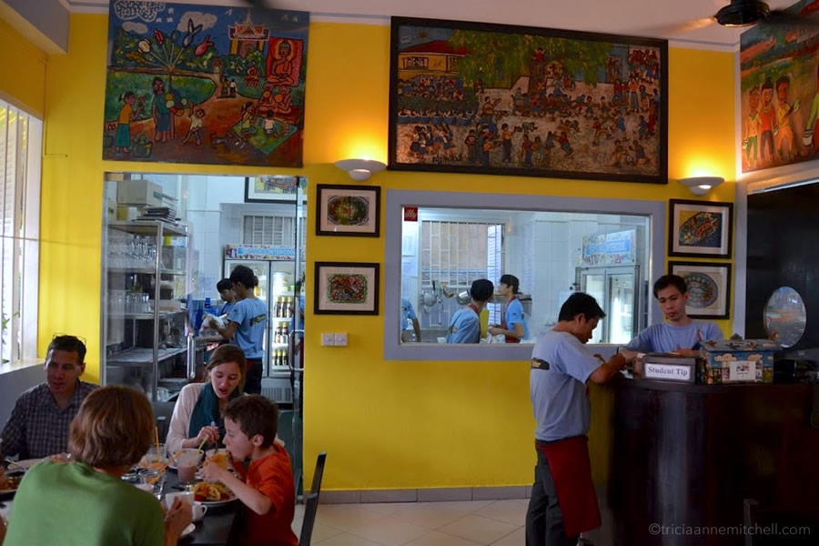 Customers dine inside Friends restaurant in Phnom Penh, Cambodia.