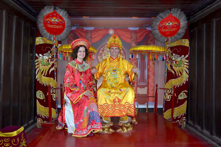 A couple sits in the Minh Khiem Chamber at the Tu Duc Royal Tomb in Hue, Vietnam.