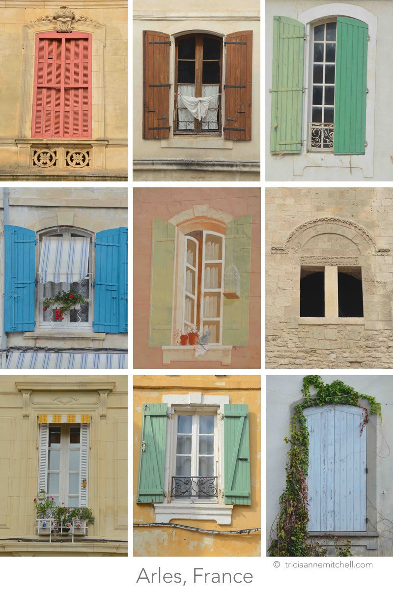 A collage featuring 9 colorful windows in Arles, France. Some are shuttered; others have flowerpots, or laundry adorning them.