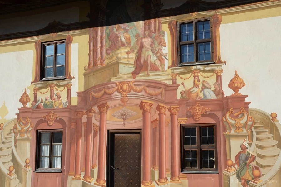 One wall of Oberammergau's Pilatushaus building has paintings depicting a religious scene.