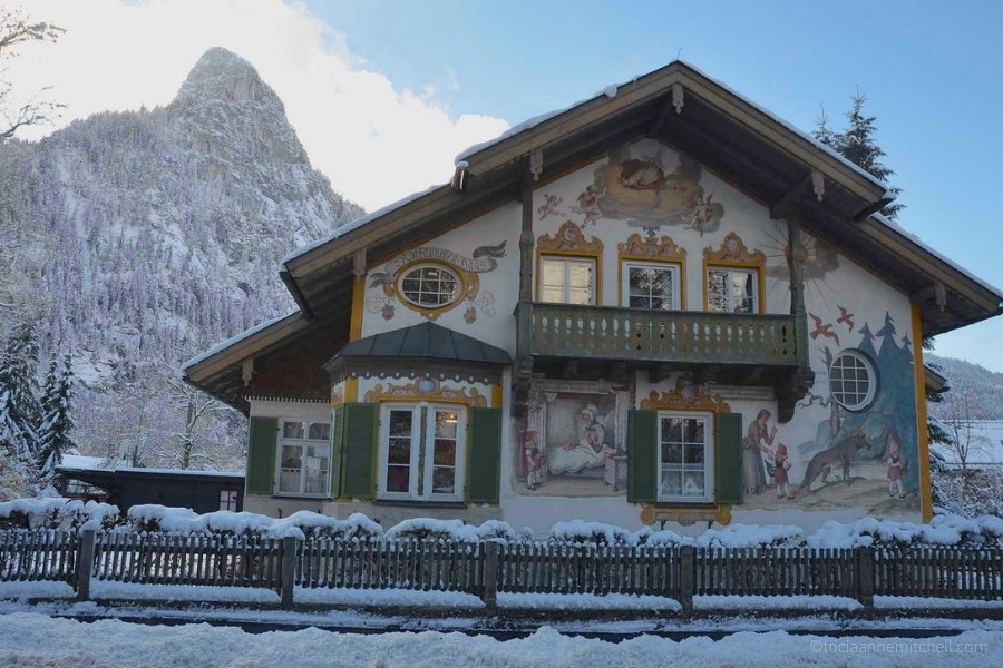 A snow-capped mountain towers over Oberammergau's 