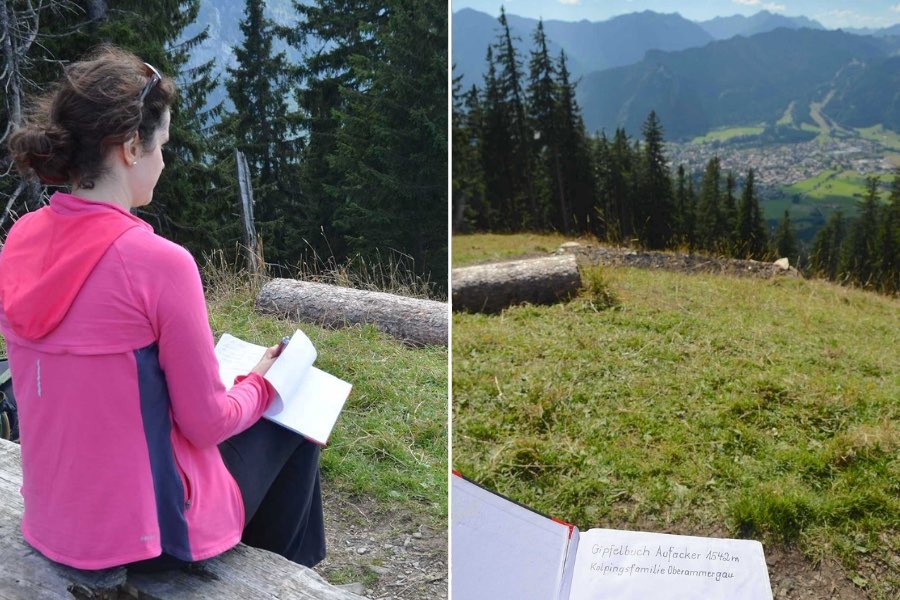 Two pictures taken from the summit of Oberammergau, Germany's Aufacker Mountain. On the left, a woman signs a book while seated on a bench. On the right, you can see an overhead view of a village, framed by mountains.