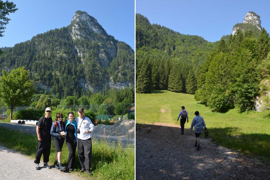 People pose under the Kofel Mountain in Oberammergau, Germany.
