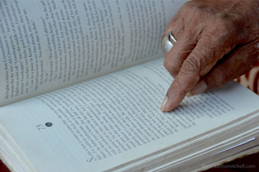 Ketut Liyer Name in Book Ketut Liyer points to his name on a page inside the book, Eat, Pray, Love.