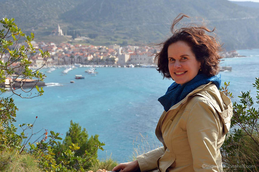 Tricia sits at an overlook point along the Adriatic Sea