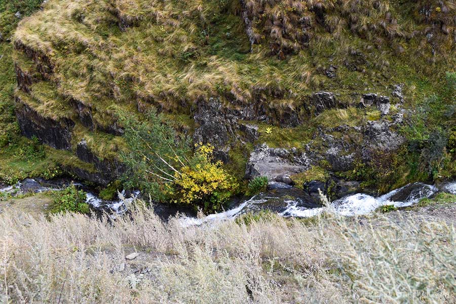An overhead shot of a stream flowing down a mountain slope near Stepantsminda, Georgia.