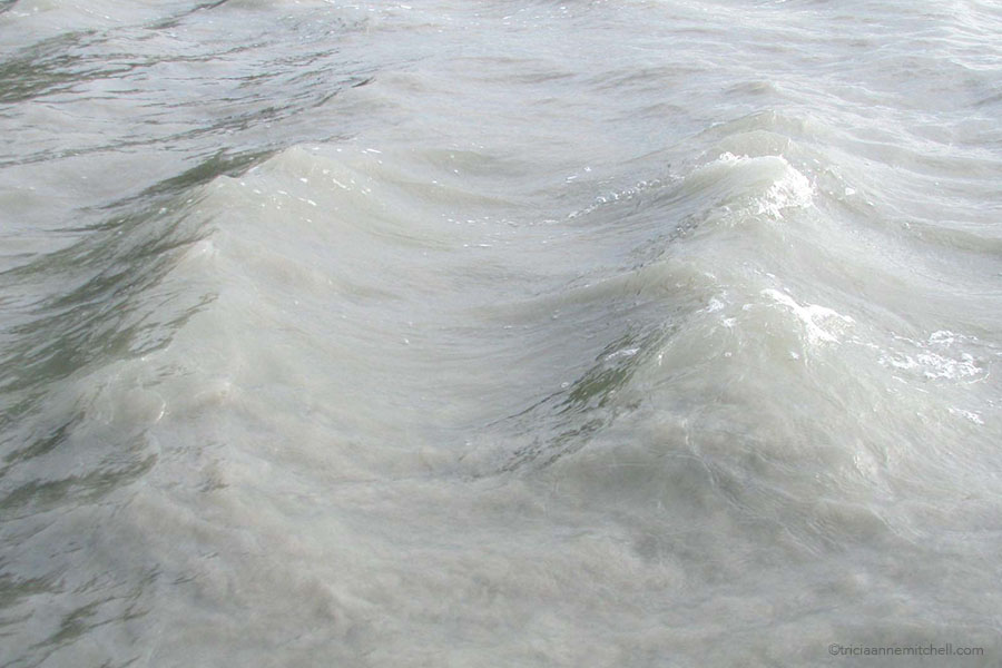 The tide coming in at Mont Saint Michel, France.