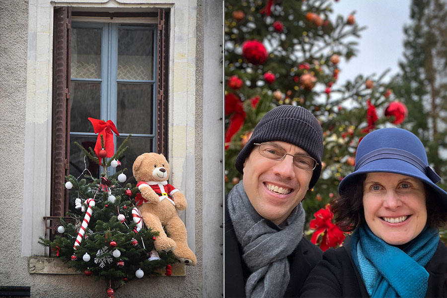 In the photo on the left, a stuffed teddy bear and small evergreen tree decorate a window of a café in Amboise, France. On the right, a man and woman wearing winter hats pose underneath a Christmas Tree at Clos Lucé château.