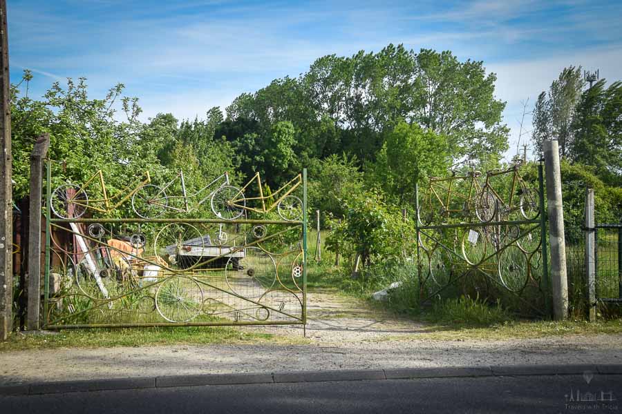 The metal frames of old bicycles adorn gates on the outskirts of Cinq Mars la Pile, France.