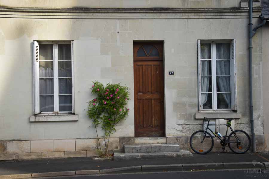A bike leans against a stone building in the French town of Cinq Mars la Pile, France.