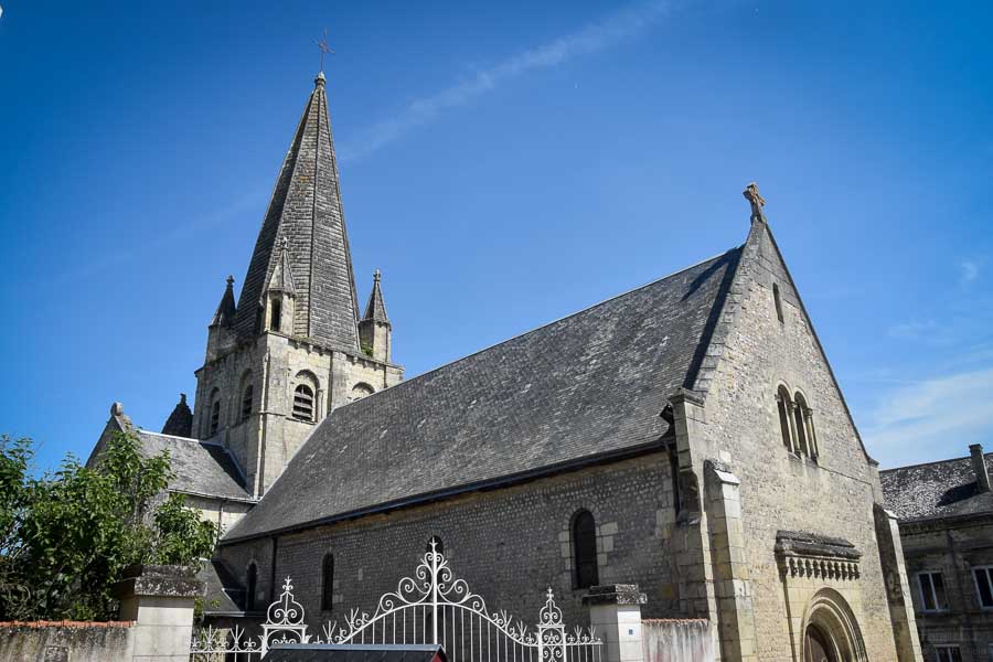 The steeple and roof of the Église Saint Martin et Saint-Médard in Cinq Mars la Pile, France.